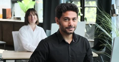 Portrait of Smiling Office Workers Looking into the Camera Stock Footage 254501153