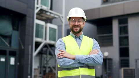 Portrait of smiling professional engineer wearing safety helmet, protective  Stock Footage 308098990