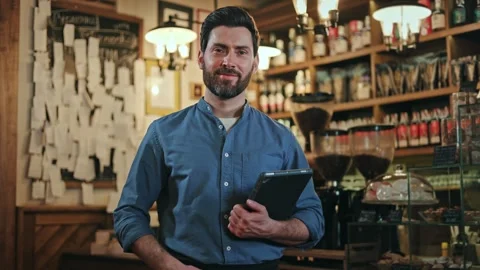 Portrait of smiling restaurant manager posing at workplace with tablet in hands Stock-Footage 260872988