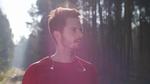 Portrait of smiling runner in the forest Stock Footage 102833060