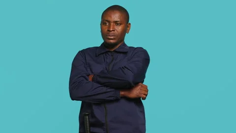 Portrait of smiling security agent securing assigned post Stock Footage 278069757