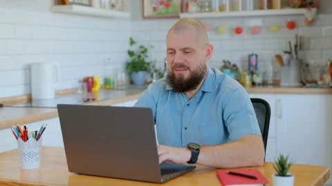 Portrait of smiling senior man working or studying remotely at home. Male Stock Footage 147075438