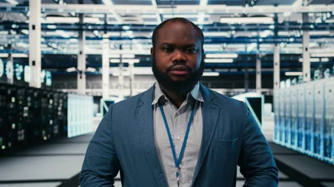 Portrait of smiling server hub worker monitoring rigs performance Stock Footage 330028671