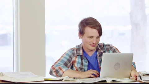 Portrait of smiling student using laptop Stock Footage 80268410