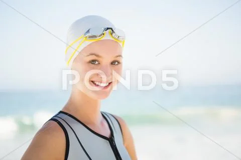 Portrait of smiling swimmer on the beach Stock Photos