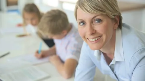 Portrait of smiling teacher in classroom Stock Footage 49751380