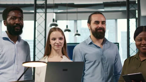 Portrait of smiling teamworking programmers utilizing AI to optimize performance Stock-Footage 313014485