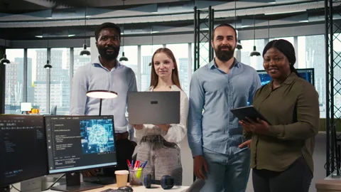 Portrait of smiling teamworking programmers utilizing AI to optimize performance Stock Footage 313164281