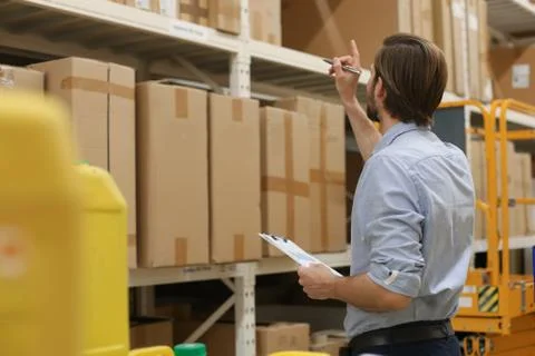 Portrait of a smiling warehouse keeper at work. Foto stock