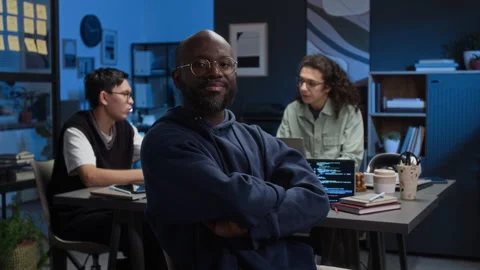 Portrait of Smiling Web Developer with Crossed Arms Working at Office Desk Video stock 329614703