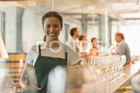 Portrait smiling winery tasting room worker Stock Photos