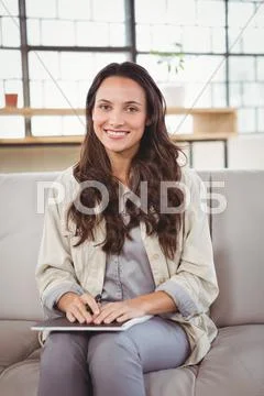 Portrait Of Smiling Woman With Notebook
