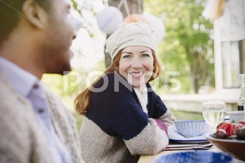 Portrait smiling woman at patio lunch table Stock Photos