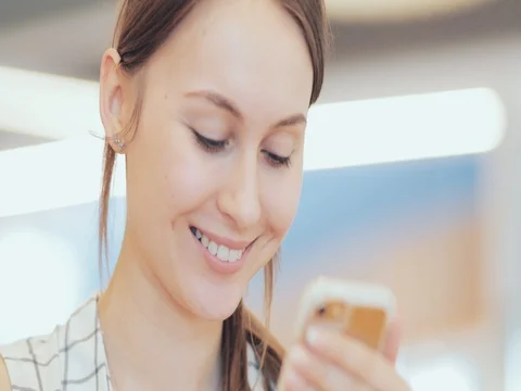 Portrait of Smiling Woman Using Smart Phone at the Mall. 4K SLOW MOTION, DCi Stock Footage 79367957