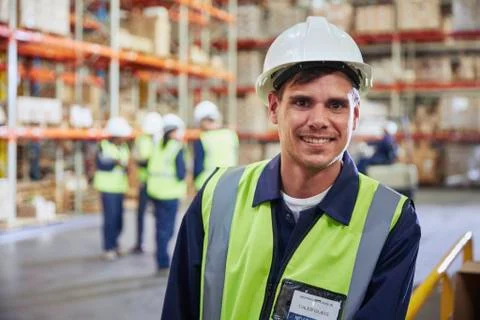 Portrait smiling worker in distribution warehouse Stock Photos