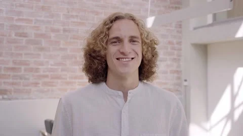 Portrait of a smiling young blond professional man standing in corporate office Stock Footage 169866264