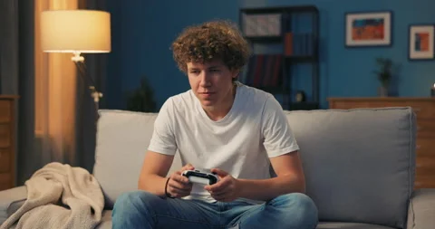 Portrait of smiling young boy, student with curly hair who is looking at the Stock Footage 162059930