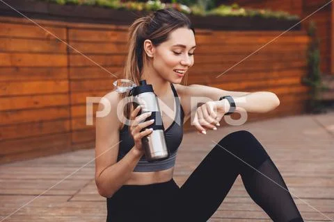 Portrait of a smiling young fitness girl Stock Photos