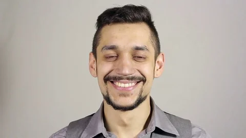 Portrait of a smiling young man with a beard Stock Footage 75351958