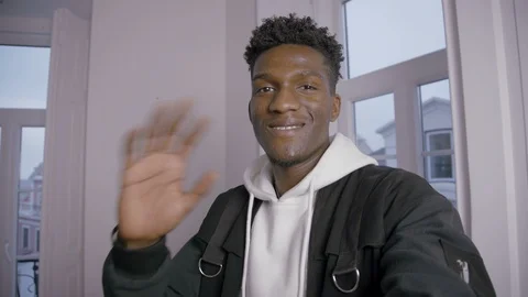 Portrait of smiling young man nodding head during video call Video stock 101428203