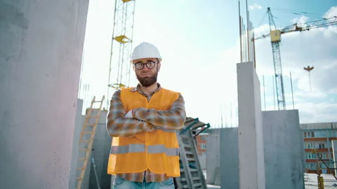 Portrait of a smiling, young professional worker in uniform wearing a helmet Video stock 241172939