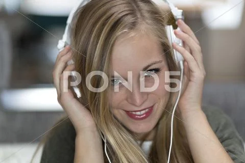 Portrait Of Smiling Young Woman With Headphones