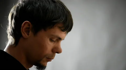 Portrait of the smoker brooding man side view 動画素材 63054261