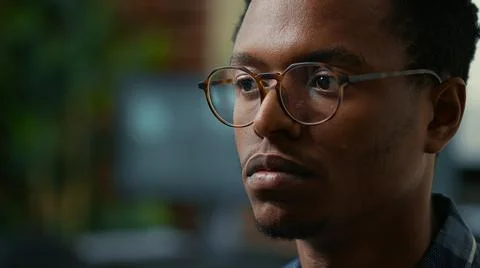 Portrait of software developer with glasses reading ai algorithm working focused 写真素材