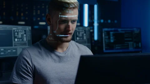 Portrait of Software Developer / Hacker Working on Personal Computer, Projected Stock Footage 103574963