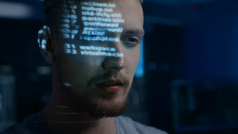 Portrait of Software Developer / Hacker Working on Computer, Projected Code Stock Footage 103575155