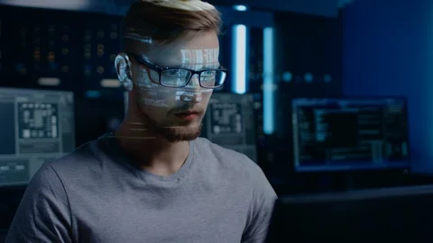 Portrait of Software Developer / Hacker Working on Computer, Projected Code Stock Footage 103575239