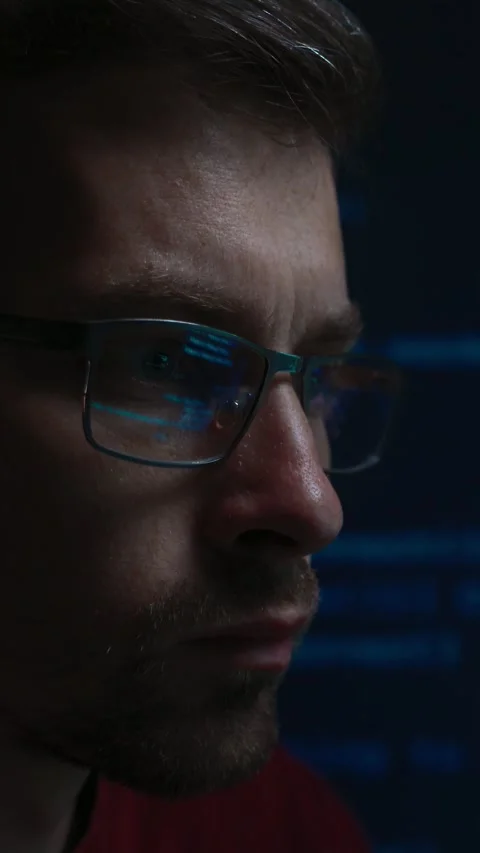 Portrait of software engineer wearing glasses with programming code background Видео 345446295