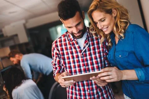Portrait of software engineers using digital tablet Stock Photos