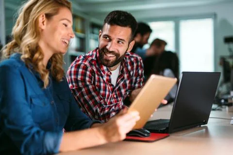 Portrait of software engineers using digital tablet Stock Photos