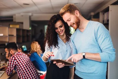 Portrait of software engineers using digital tablet Stock Photos