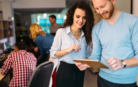 Portrait of software engineers using digital tablet Stock Photos