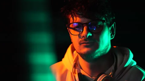 Portrait of Software Programmer or Hacker With Glasses in Front of Monitor Stock Footage 302977965