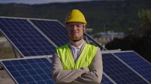 Portrait of solar engineer in protective helmet crossing arms while looking to Stock Footage 289020665