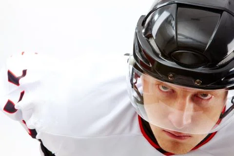 Portrait of sportsman in hockey uniform looking at camera with severe expression Stock Photos