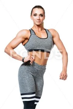 A portrait of a sporty young woman posing over the white background. Beauty, Stock Photos