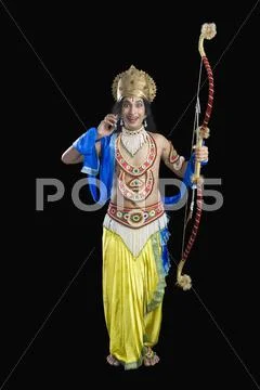 Portrait of a stage artist dressed-up as Rama the Hindu mythological character Stock Photos