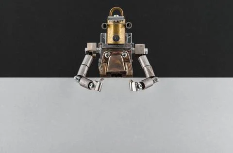 Portrait of a steampunk robot looking around the corner. Stock Photos