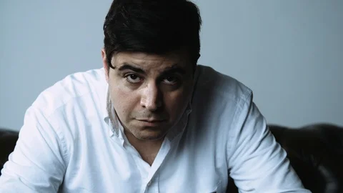 Portrait of Stern Dark Haired Man Looking at the Camera Stock Footage 120426748