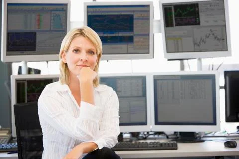 Portrait Of Stock Trader In Front Of Computer Monitors Stock Photos