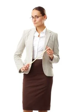 Portrait of strict teacher with pointer looking at camera Stock Photos