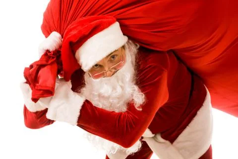 Portrait of strong santa claus with big red sack looking at camera Stock Photos