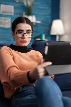Portrait of student looking at tablet computer screen 库存照片