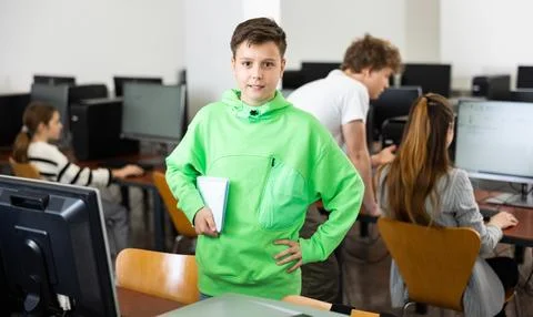 Portrait of a student with a notebook in computer class Stock Photos