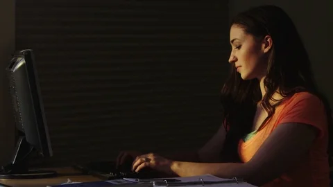 Portrait of student typing on computer in the dark Stock-Footage 80227183