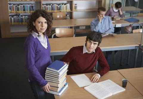 Portrait of students in library Stock Photos